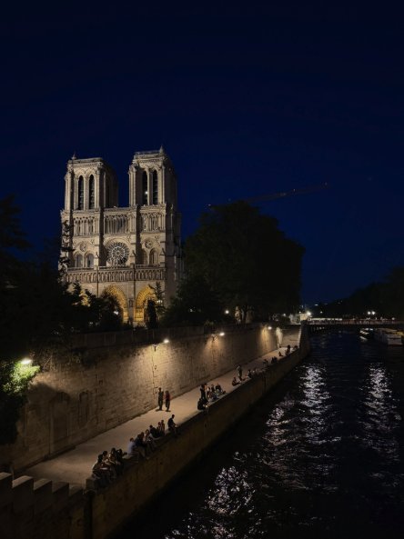 Notre-Dame Cathedral floodlit against the Paris night sky